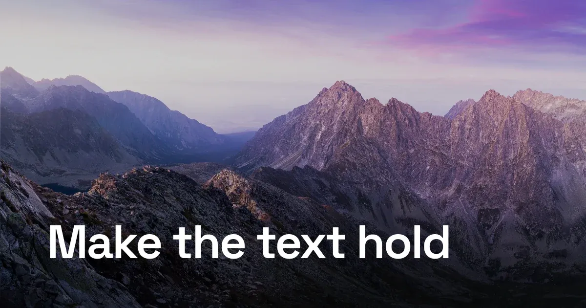 The same headline anchored on a gradient scrim along the bottom, crisp while the peaks above stay bright.
