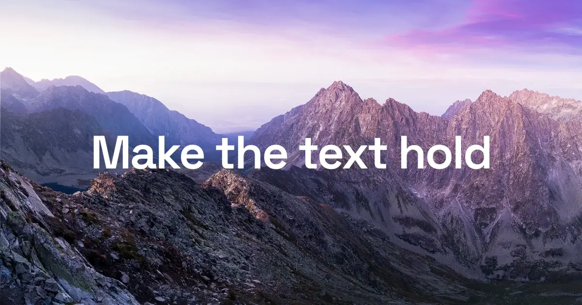 A white headline floating raw over a mountain photo, washing out where it crosses the bright haze on the left.